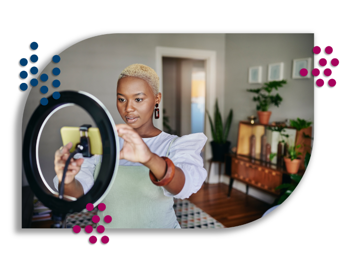 Female setting up phone to shoot video in her office.