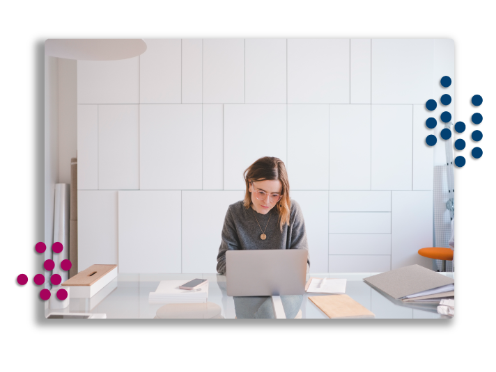 Woman typing email on laptop.