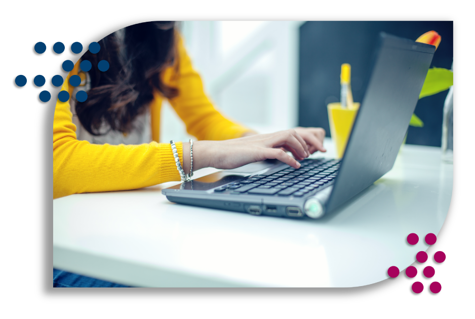 Young adult female working on a laptop.